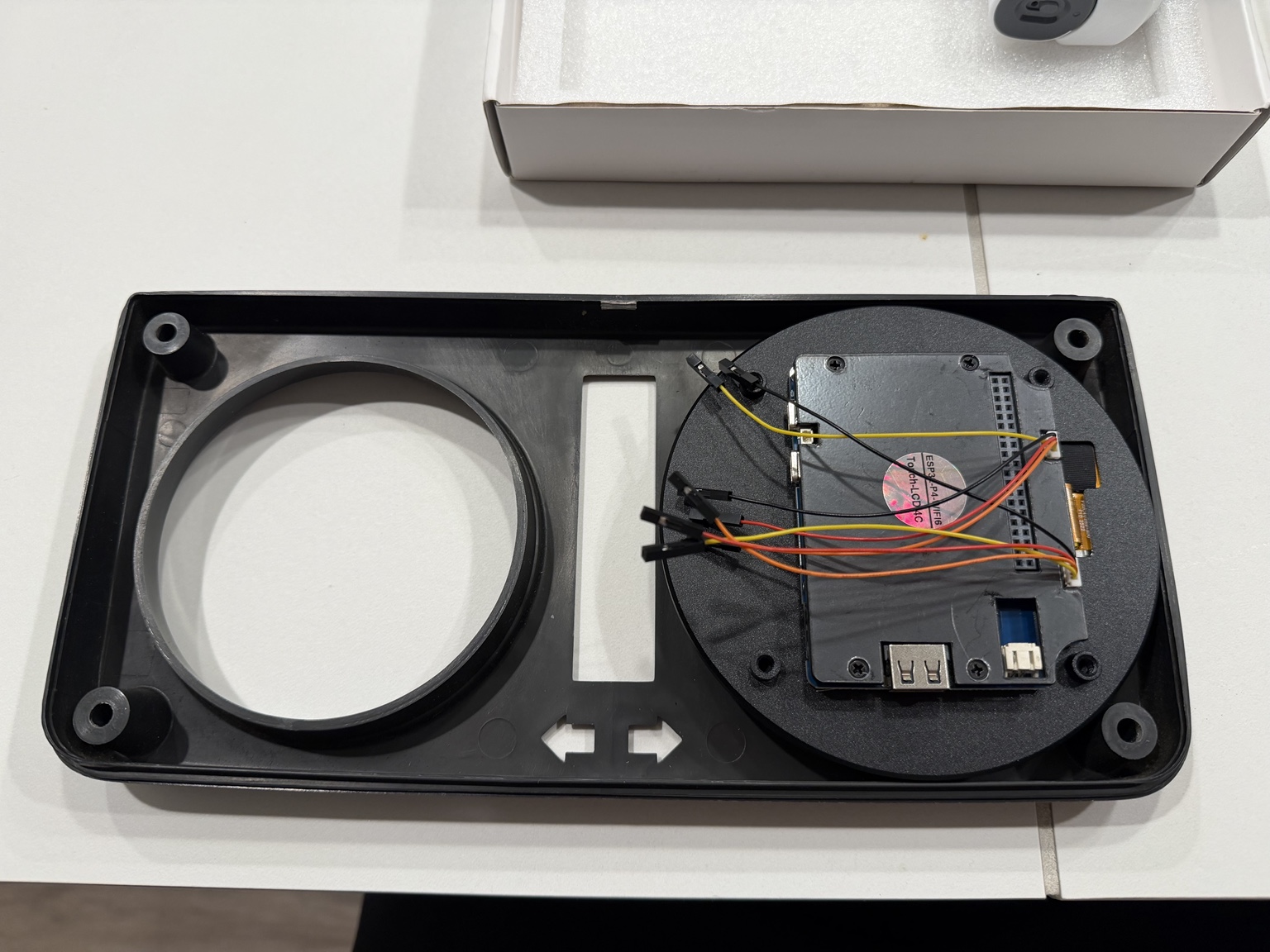 Rear of the round display test-fitted into the original Samurai instrument cluster housing
