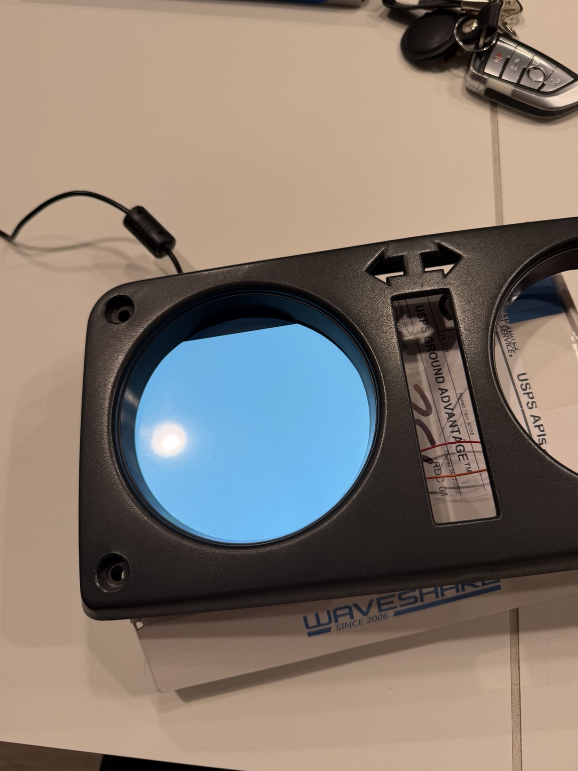 Round display test-fitted into the front of the original Samurai gauge cluster